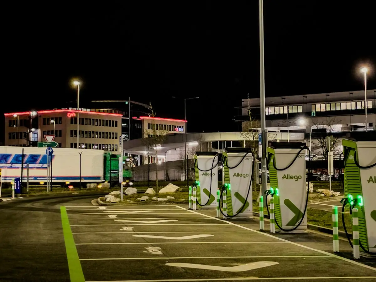 Row of electric vehicle charging stations at night (stock photo)